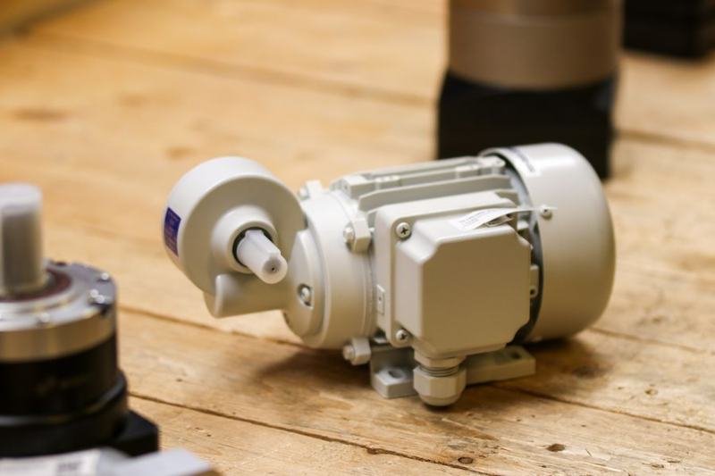 Industrial geared electric motor on a workshop bench